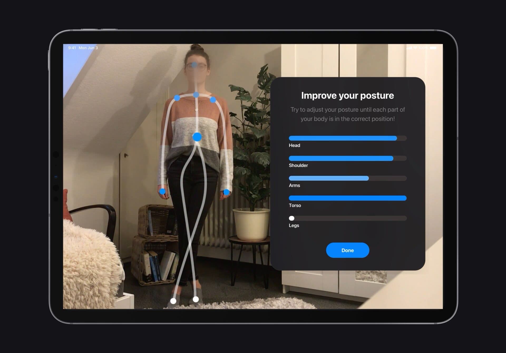 The posture exercise running on an iPad: the camera sees a woman standing in a living room with a skeleton traced over her, while a panel scores her head, shoulders, arms, torso and legs